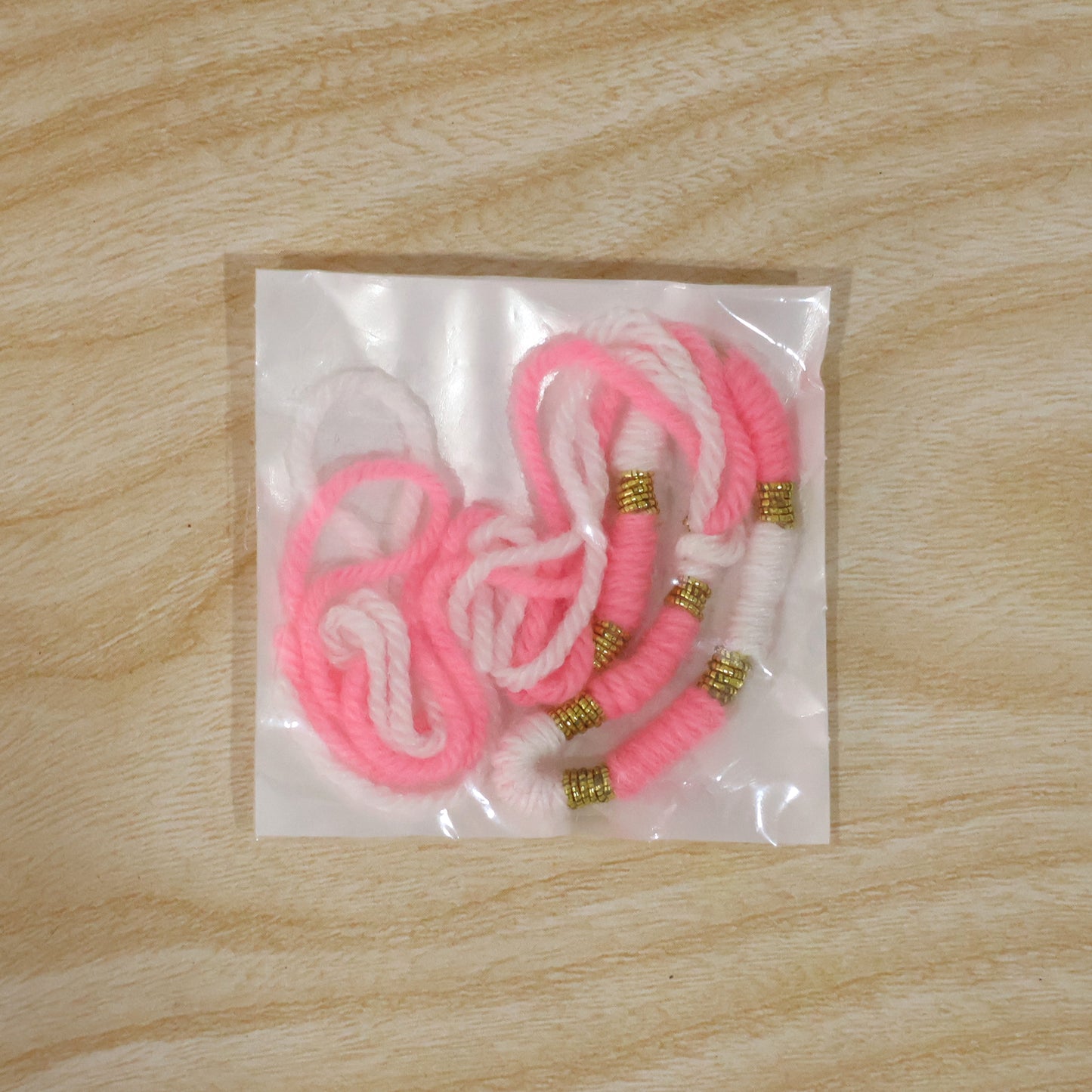 Cute Pink White Thread Rakhi For Brother With Golden Beads (1 Pc)